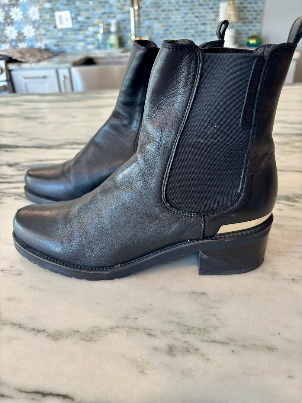 Stuart Weitzman Black Leather Chelsea Ankle Booties with Metallic Accent